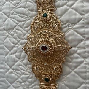Elegant Gold Tunisian belt with red and green gems. Approx. 42 inches long.